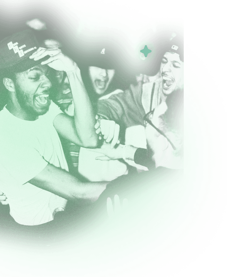 A man in a white crew neck t-shirt wearing a black cap