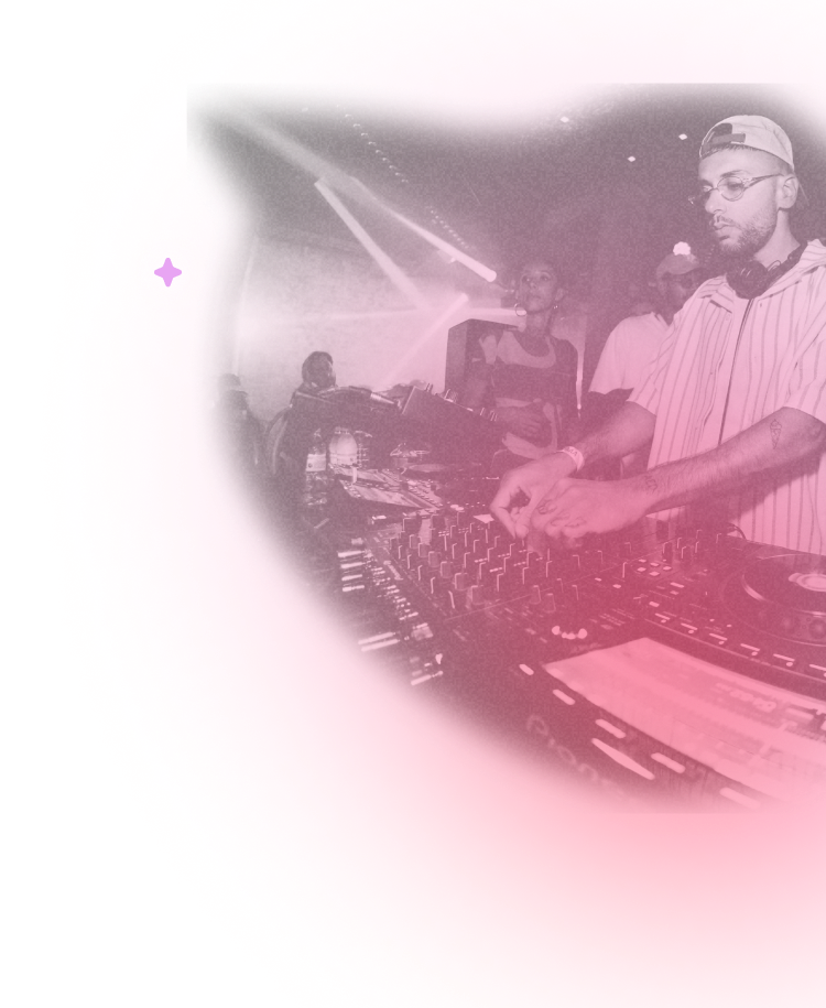 A DJ mixing music in front of a crowd of people